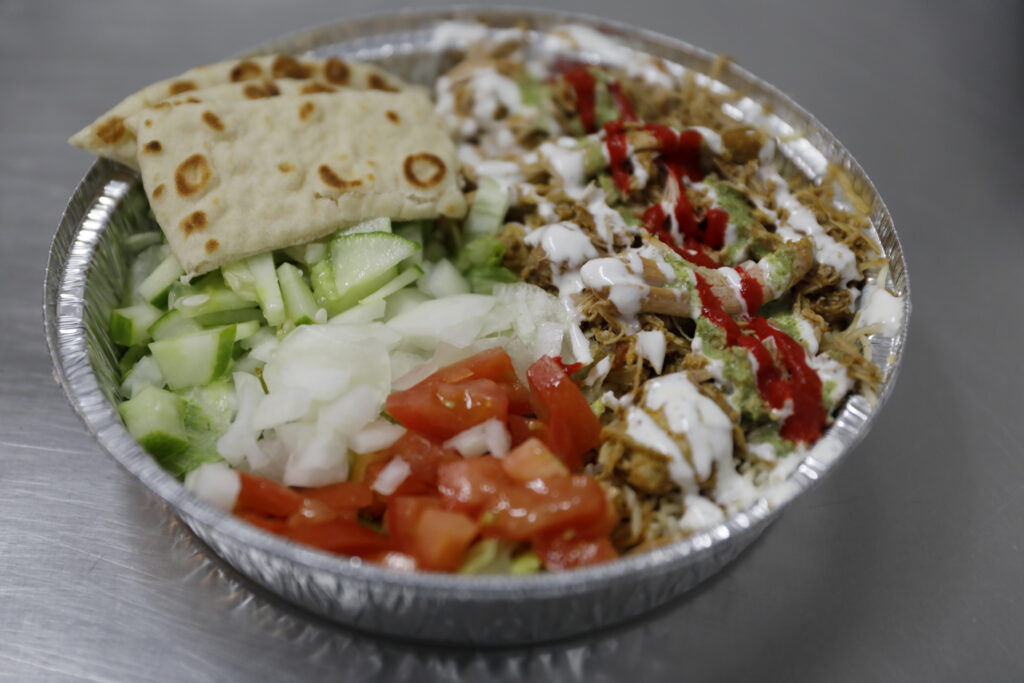 Chicken served with Persian rice, salad and pita bread at ZamZam in Santa Rosa, Calif. on Monday, July 25, 2022. (Beth Schlanker/The Press Democrat)