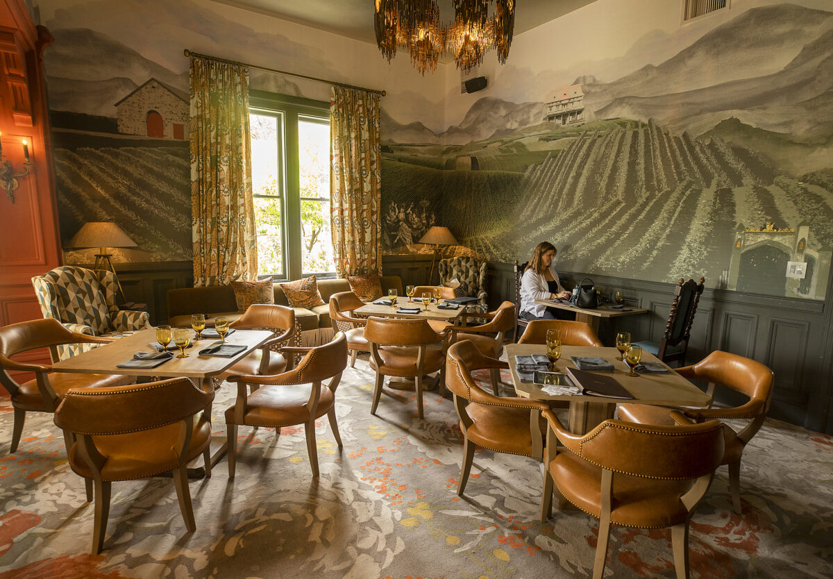 A wallpaper mural of the Madrona Manor, est. 1881, in one of the three dining areas at The Madrona in Healdsburg Friday, June 3, 2022. (John Burgess / The Press Democrat)