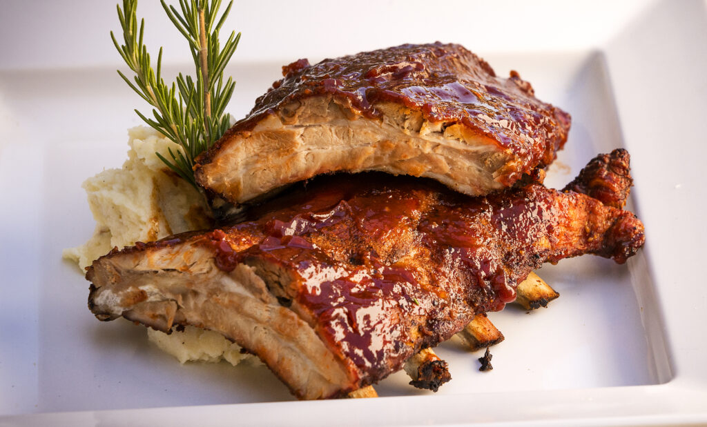 BBQ Pork Ribs with mashed potatoes & parsnips from A La Heart Kitchen in Forestville Friday, July 1, 2022. (John Burgess / The Press Democrat)