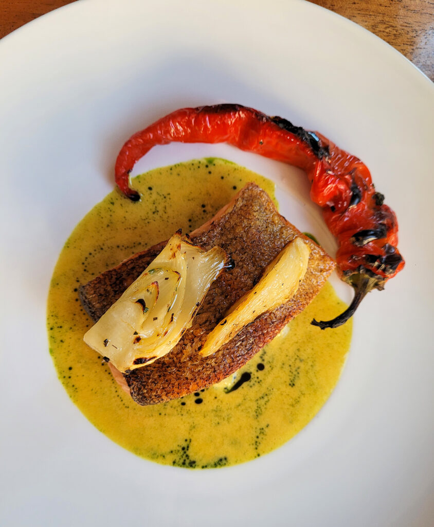 Mount Lassen trout with saffron nage, nardello, baby fennel is served at Barndiva in Healdsburg. (Heather Irwin / The Press Democrat)