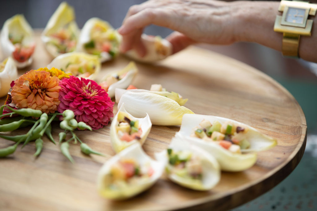A guest takes an appetizer at the Sonoma Magazine 10th Anniversary Party at Buena Vista Winery in Sonoma, CA The event took place on July 28, 2022. (Photo by Charlie Gesell)