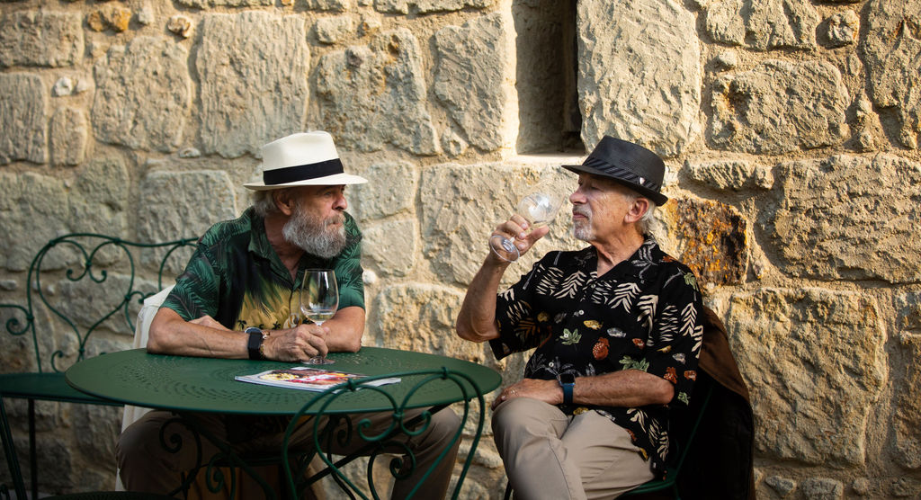 Steven Wolan and Alan Garber enjoy a glass of wine at the Sonoma Magazine 10th Anniversary Party at Buena Vista Winery in Sonoma, CA which took place on July 28, 2022. (Photo by Charlie Gesell)