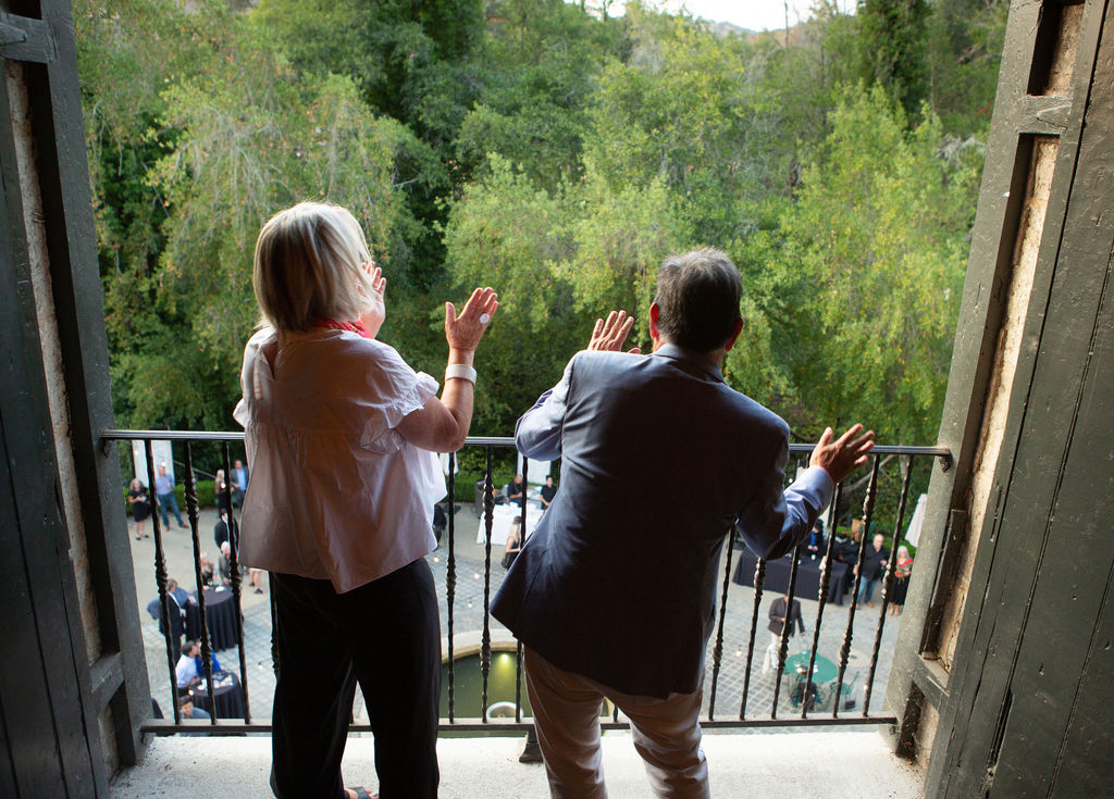Lene Jannes, left, and her husband SRJC President Frank Chong dance on the upper balcony at the Sonoma Magazine 10th Anniversary Party at Buena Vista Winery in Sonoma, CA. The event took place on July 28, 2022. (Photo by Charlie Gesell)