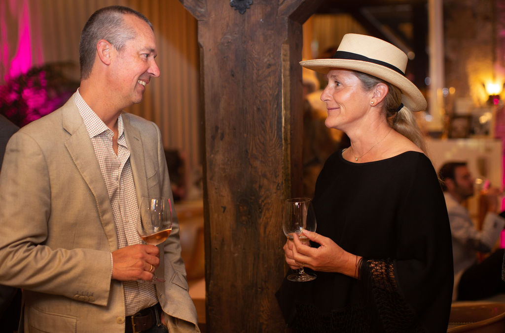 Tania Soderman, right, of Sonoma Chicks talks with Alex Macievich at the Sonoma Magazine 10th Anniversary Party at Buena Vista Winery in Sonoma, CA. The event took place on July 28, 2022. (Photo by Charlie Gesell)