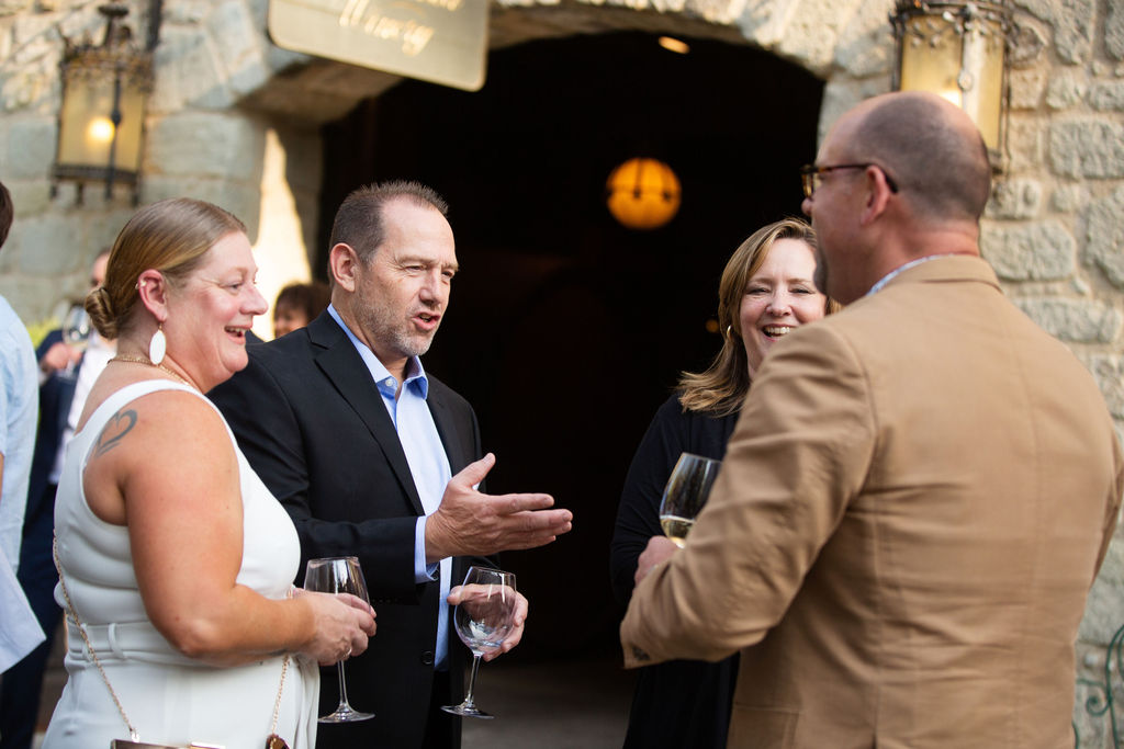 Joelynn Lee, left, and Robert Lee speak with Tyffani Sedgwick and Todd O'Leary at the Sonoma Magazine 10th Anniversary Party at Buena Vista Winery in Sonoma, CA. The event took place on July 28, 2022. (Photo by Charlie Gesell)
