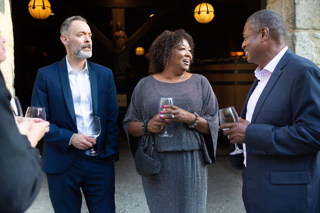 Sonoma Media's Chief Revenue Strategist Adam Bush, left, speaks with North Bay Business Journal Publisher Lorez Bailey and her husband, SSU Senior Academic Advisor Andre Bailey, at the Sonoma Magazine 10th Anniversary Party at Buena Vista Winery in Sonoma, CA. The event took place on July 28, 2022. (Photo by Charlie Gesell)