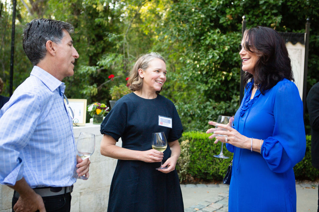 Jeff Davies, left, talks with Abigail Peterson, center, and Wendy Davies, executive director of the Sonoma-Mendocino-Lake County Medical Association, at the Sonoma Magazine 10th Anniversary Party at Buena Vista Winery in Sonoma, CA. The event took place on July 28, 2022. (Photo by Charlie Gesell)
