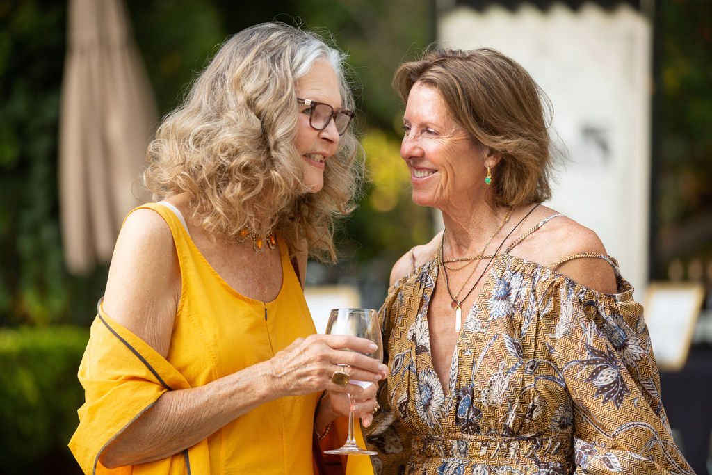 Marilyn Kravig, left, and Margy Titus talk at the Sonoma Magazine 10th Anniversary Party at Buena Vista Winery in Sonoma, CA. The event took place on July 28, 2022. (Photo by Charlie Gesell)