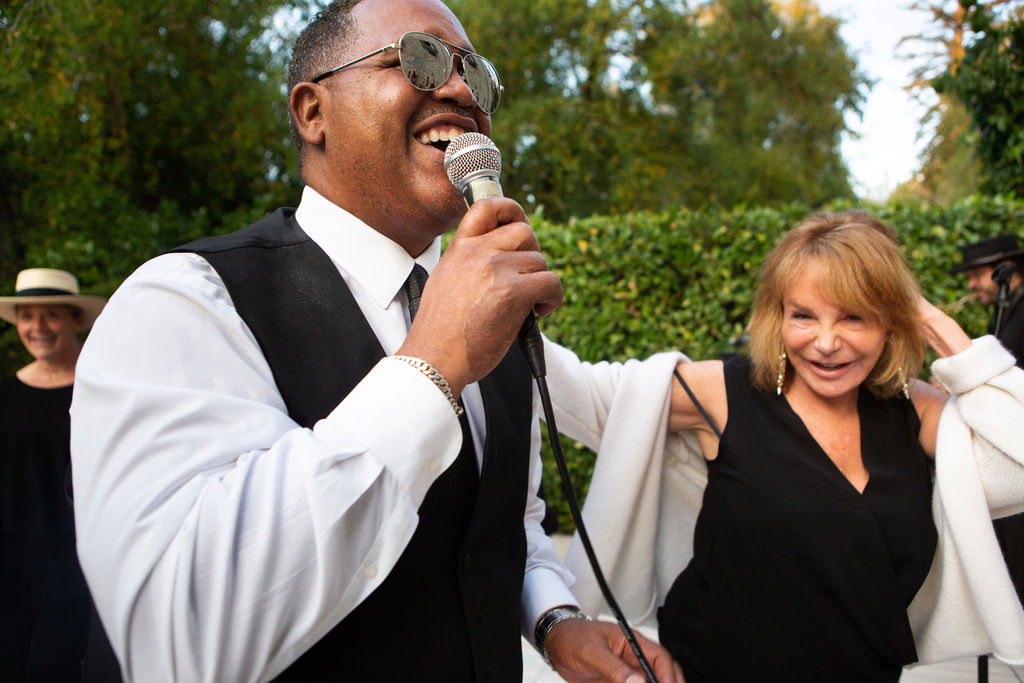 Singer Murry Johnson, left, and Notra Vue's Renee Brown-Stein dance and sing at the Sonoma Magazine 10th Anniversary Party at Buena Vista Winery in Sonoma, CA. The event took place on July 28, 2022. (Photo by Charlie Gesell)