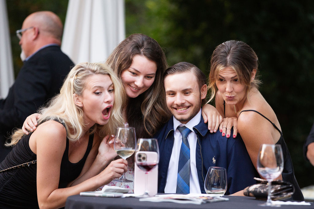 The Anaba Wines Marketing Team Lyndsay Knox, left, Emily Hurst, Craig Zschach and Taylor Clark pose for a selfie at the Sonoma Magazine 10th Anniversary Party at Buena Vista Winery in Sonoma, CA. The event took place on July 28, 2022. (Photo by Charlie Gesell)