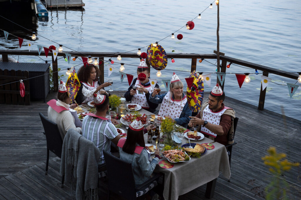 Crayfish parties are an annual tradition in Sweden where people come together to eat crayfish between rounds of schnapps and silly drinking songs. The crayfish parties normally take place in August and mark the end of summer. (Anna Hållams/imagebank.sweden.se)