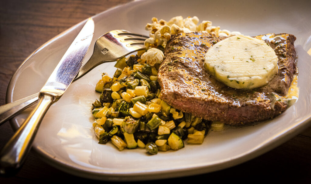 Grilled Flat Iron with Sonoma succotash, popcorn and herbed butter from The Farmstand at the Farmhouse Inn in Forestville Tuesday, August 16, 2022. (John Burgess/The Press Democrat)