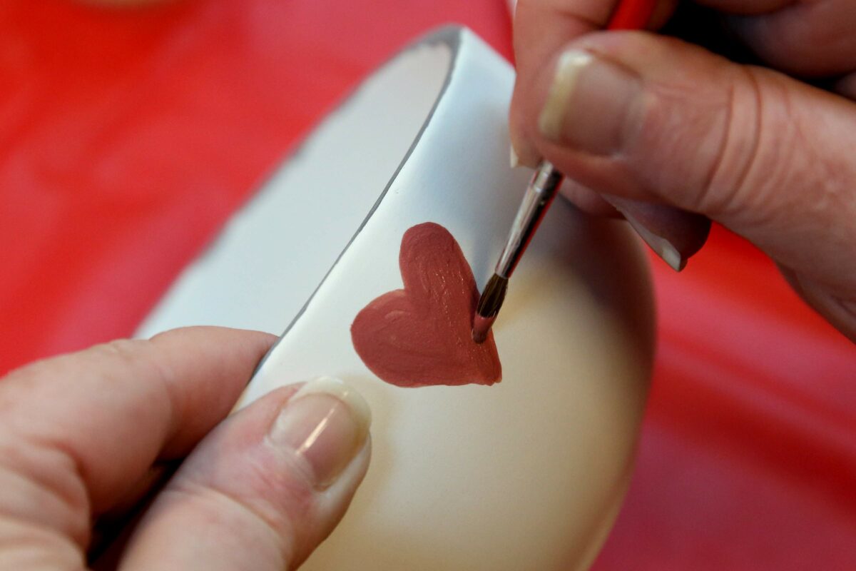 Jeanette Genovese paint a bowl for the 1,000 Petaluma Bowls fundraising event for the Petaluma People Services Center. Photos taken at Elim Lutheran Church in Petaluma on Sunday, November 11, 2018. (BETH SCHLANKER/ The Press Democrat)