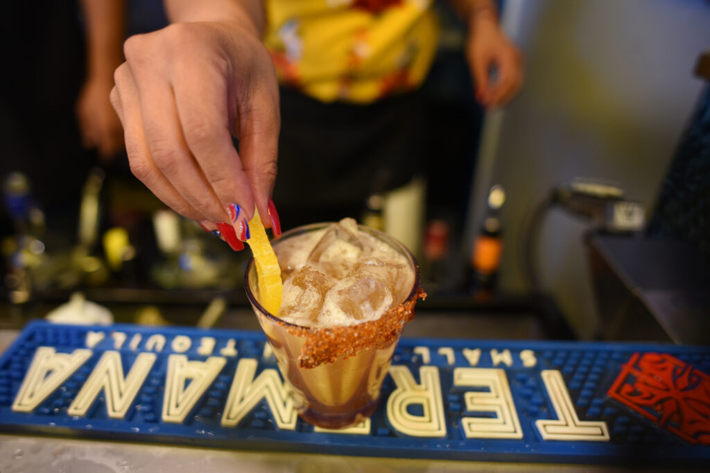 Alma Castro working the full cocktail bar located in the new Mitote Food Park during the ribbon cutting celebration on Sebastopol Road in the Roseland neighborhood of Santa Rosa, Calif. on Thursday, July 14, 2022. (Erik Castro / For The Press Democrat)