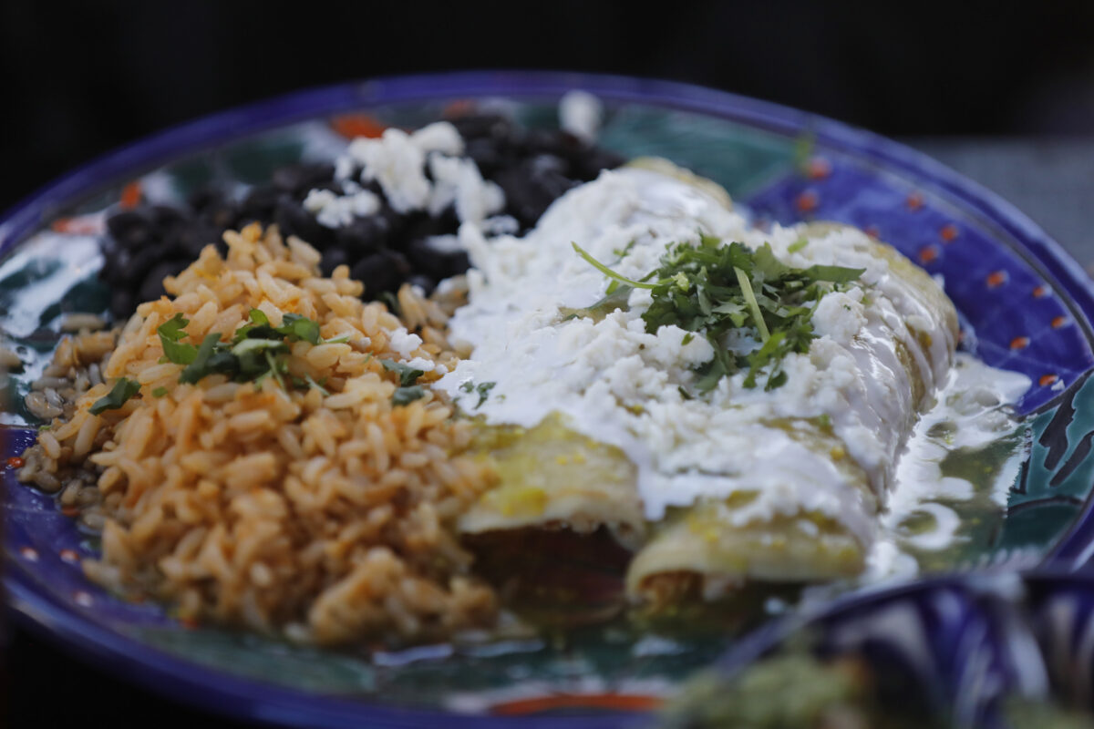 Chicken enchiladas served with beans and rice at Tortilla Real Mexican Kitchen in Petaluma. (Beth Schlanker/The Press Democrat)