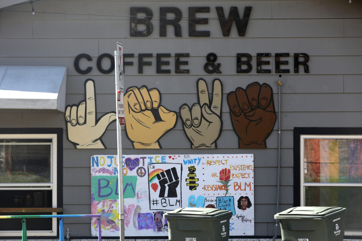 A large hand-painted sign in support of Black Lives Matter is displayed outside at Brew Coffee and Beer House in Santa Rosa, on Thursday, Feb. 25, 2021. (Beth Schlanker/The Press Democrat)
