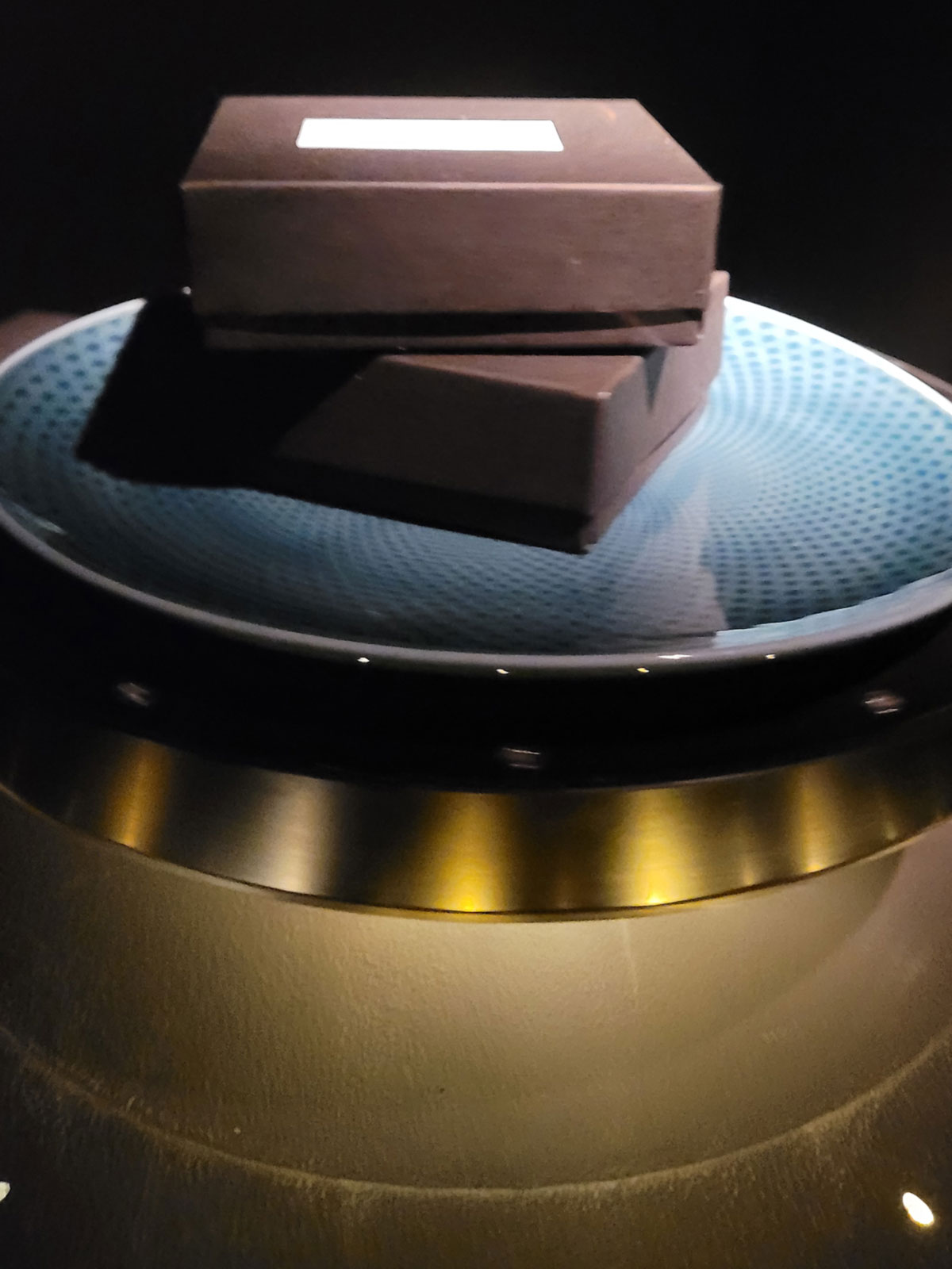 Levitating chocolate bon bon boxes on the opening menu at Cyrus restaurant in Geyserville. (Heather Irwin / Sonoma Magazine)