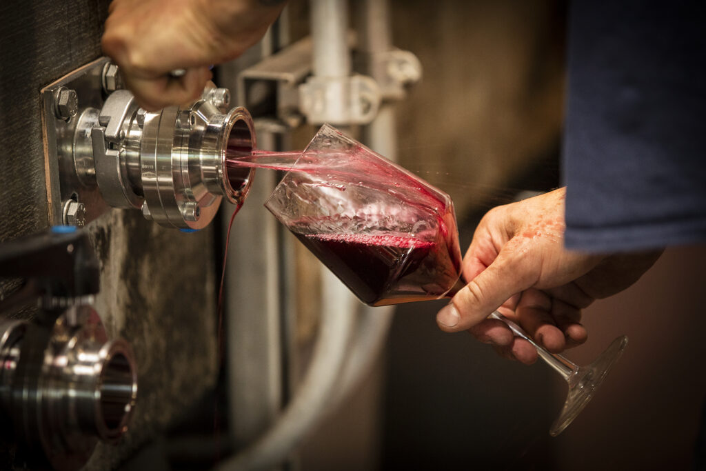 Drawing Monte Rio Cellars wine from tanks for tasting after blending in the Pax Wines' winemaking facility at The Barlow in Sebastopol. (John Burgess/Sonoma Magazine)