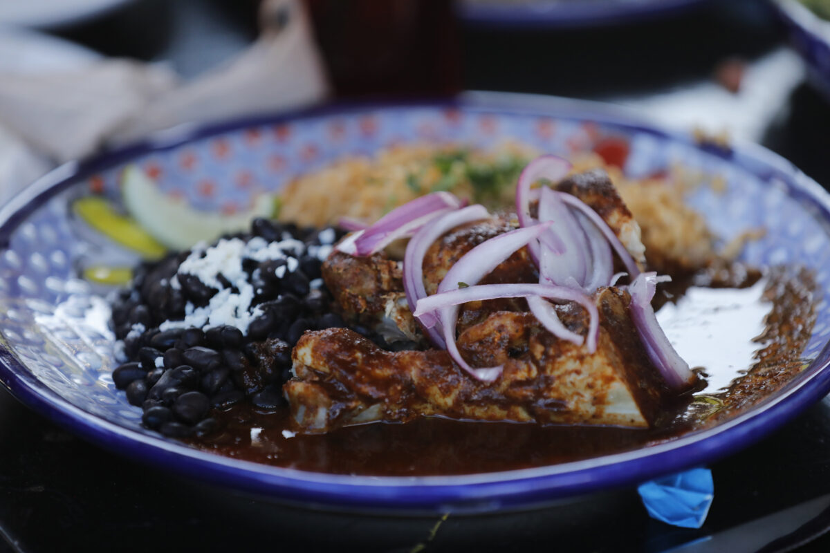 Mole sauce over chicken, served with beans, rice, and organic homemade tortillas at Tortilla Real Mexican Kitchen, which is participating in the Sonoma County Restaurant Week in Petaluma, on Monday, February 21, 2022. (Beth Schlanker/The Press Democrat)