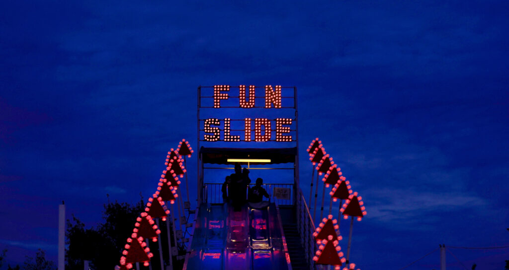 Visitors to Punky's Pumpkin Patch at the Luther Burbank Center for the Arts use the giant slide before picking out their pumpkins, Tuesday, Oct. 19, 2021, in Santa Rosa. (Kent Porter / The Press Democrat)