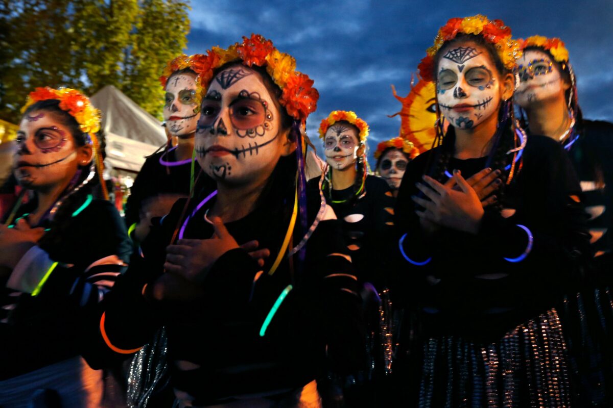 Dancers with Windsor Bloco participate in the Dia de los Muertos procession in Petaluma on Saturday, October 29, 2016. (Alvin Jornada / The Press Democrat)