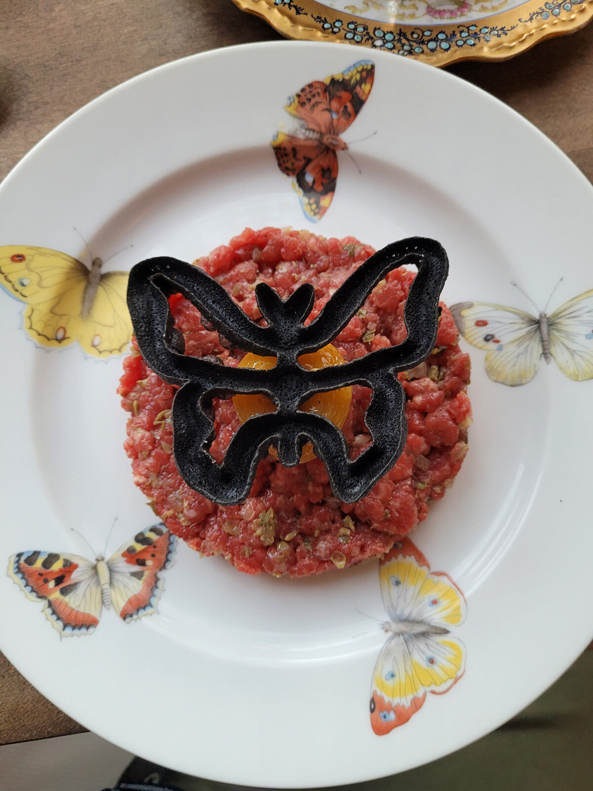 Steak tartare combines a butterfly tuille, sauce raviote, cured egg and Dijon at Troubadour Bread and Bistro in Healdsburg. (Heather Irwin / The Press Democrat)