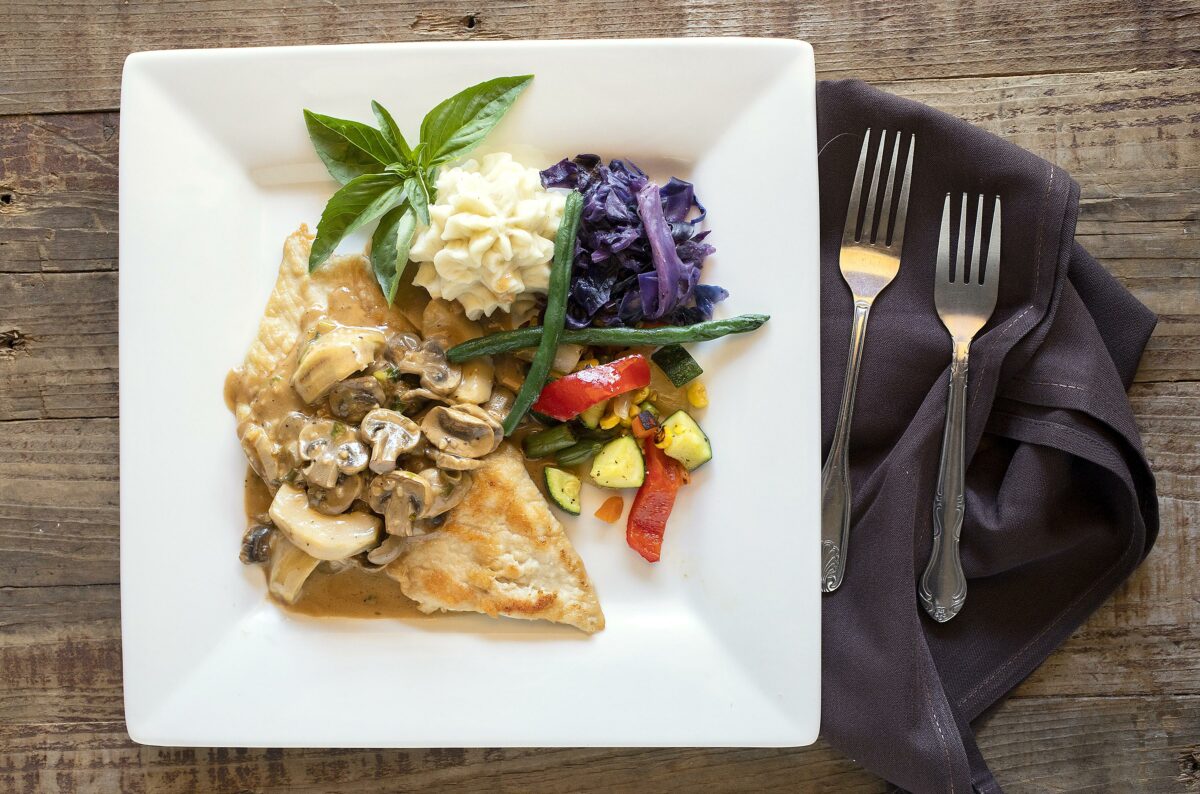 Chicken Veneziana with artichoke and mushrooms in a light marsala sauce from owner/chef José Pelayo of Piacere Italian Steak & Seafood in Cloverdale. (John Burgess/The Press Democrat).