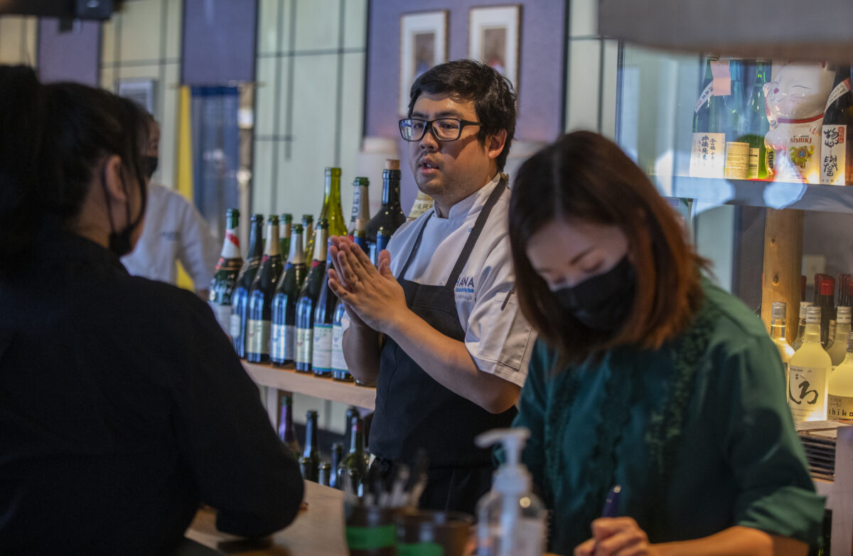 Chef Keita Tominaga goes over the evenings menu with staff at Hana Japanese Restaurant in Rohnert Park September 21, 2022. (Chad Surmick / The Press Democrat)