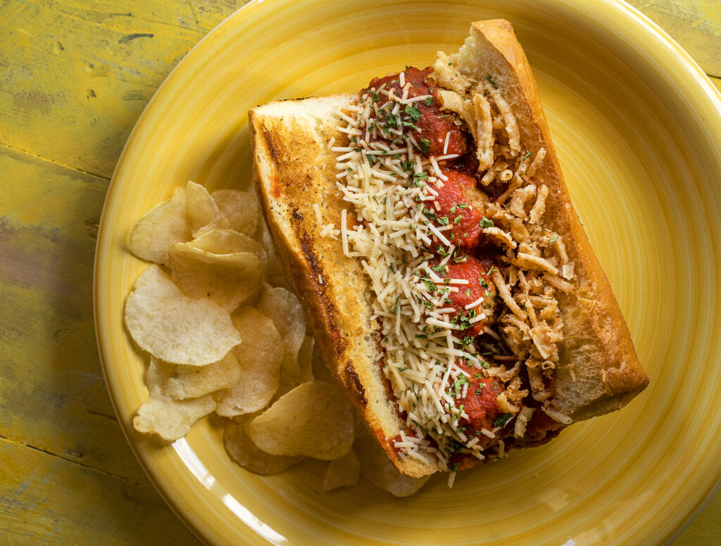 The Meatball Sub on a toasted ciabatta roll with provolone and asiago cheese, marinara and french fried onions from Canevari's Delicatessen & Catering in Santa Rosa. (Photo by John Burgess/The Press Democrat)