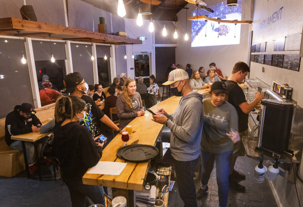 Fans of beer and trivia fill the seats on a Wednesday night at Parliament Brewing Company in Rohnert Park on February, 15, 2022. (John Burgess/The Press Democrat)