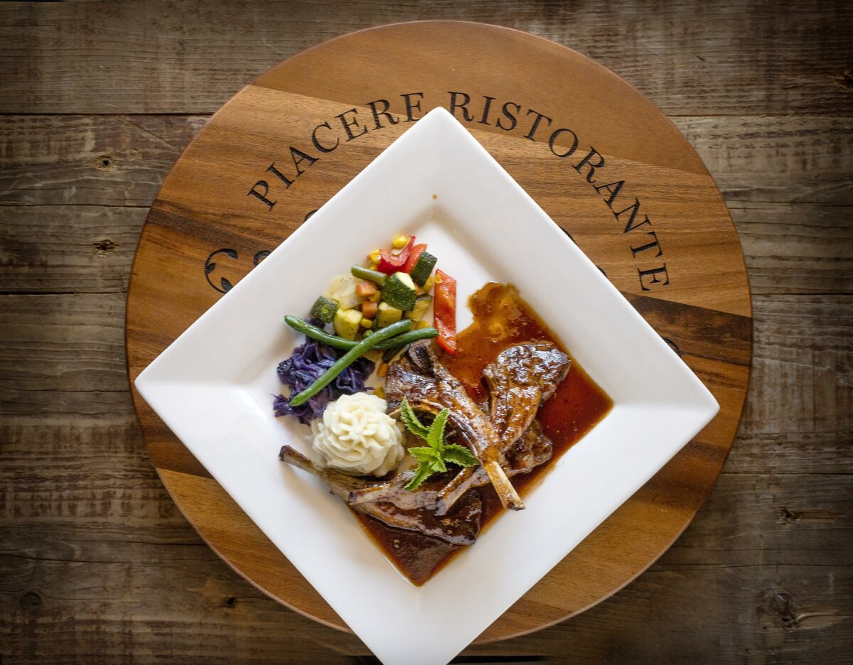 Rack of Lamb with a Cabernet Demi-Glace with braised red cabbage, garlic mashed potatoes and seasonal veggies from owner/chef José Pelayo of Piacere Italian Steak & Seafood in Cloverdale. (John Burgess/The Press Democrat).