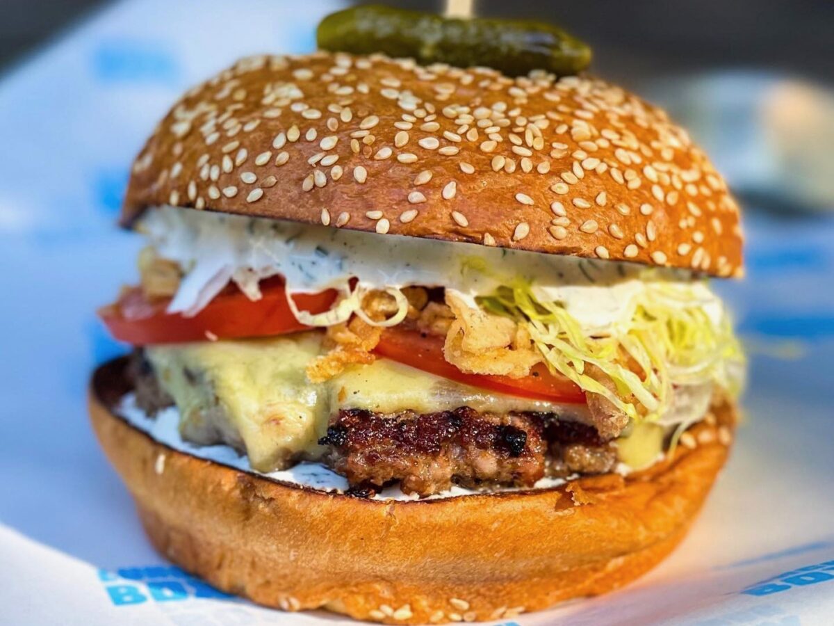 House-ground patty with Sonoma County Meat Co. bacon and brisket and chuck, chèvre ranch, Joe Matos cheese, crispy shallots, tomato, and shredded iceberg on Costeaux French Bakery brioche. (Lunch Box)