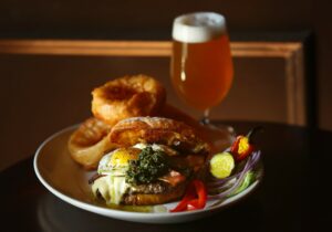 The build-it-yourself burger is served with a glass of Russian River Brewery's Defenestration at Stark's Steak & Seafood in Santa Rosa. (John Burgess/The Press Democrat)