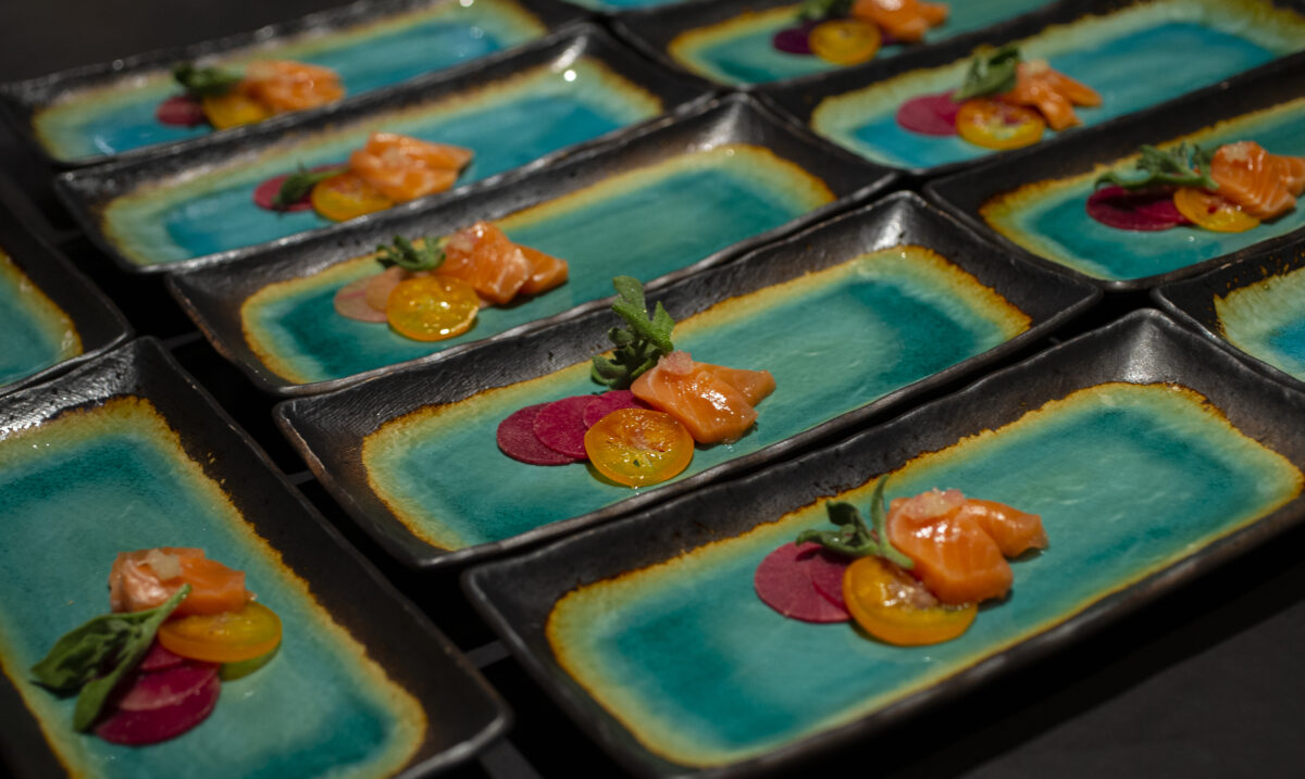 During a family and friends pre-opening night salmon, kumquat, finger lime and shio koji are plated for service at Cyrus in Geyserville on Thursday September 8, 2022. (Chad Surmick / Press Democrat)