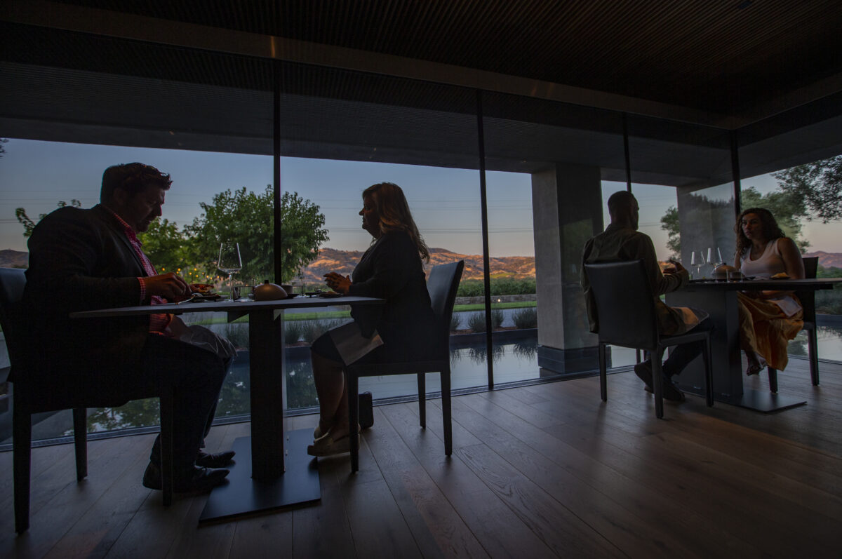 During a family and friends pre-opening night, guests enjoy the dining room with sweeping views at sunset of the Alexander Valley at Cyrus in Geyserville on Thursday September 8, 2022. (Chad Surmick / Press Democrat)