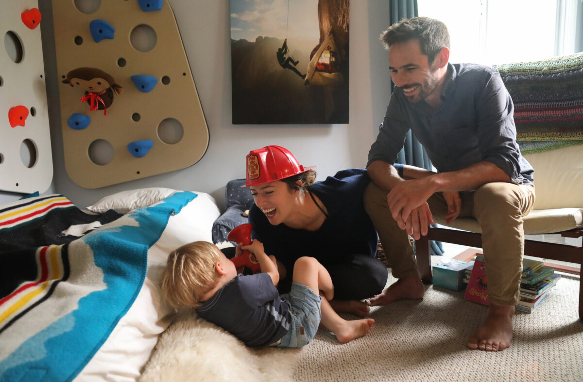 Jacqui and Kevin Jorgeson play with their 22-month-old son, Edsel, at home in Santa Rosa on Friday, October 2, 2020. Jacqui Jorgeson is the founder of the Volunteer Fire Foundation. (Christopher Chung/The Press Democrat)