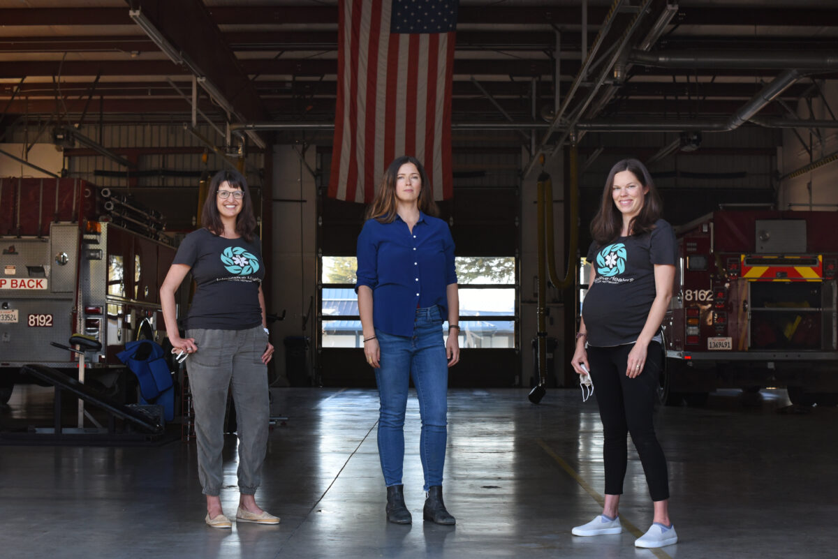 Volunteer Fire Foundation founder Jacqui Jorgeson, center, with Integrative Healers Action Network co-founders Jenny Harrow-Keeler, left, and Dr. Jen Riegle during a health and wellness event hosted by the two organizations for volunteer firefighters at Gold Ridge Fire District station in Sebastopol. (Erik Castro/for The Press Democrat)