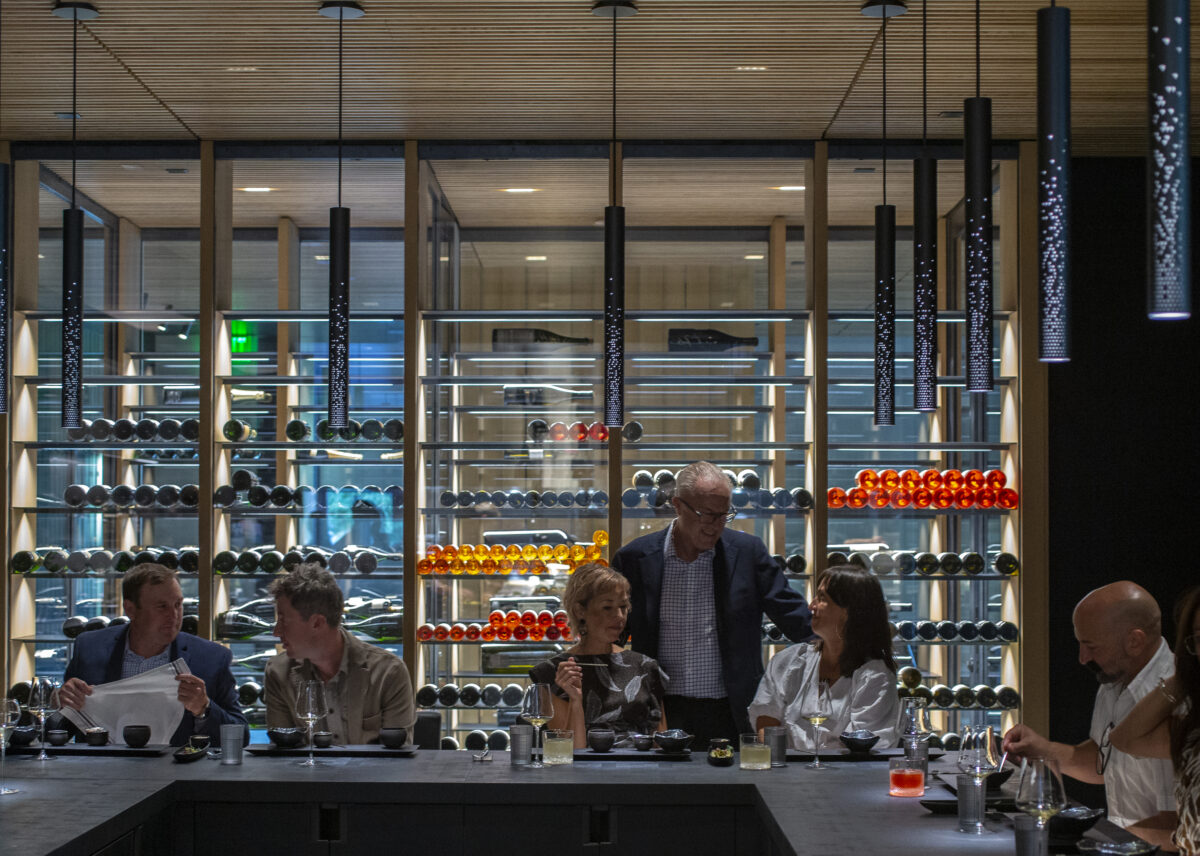 Guests enjoy the Kitchen Table while chatting with Maitre'd Hotel / Owner Nick Peyton at Cyrus in Geyserville. (Chad Surmick/The Press Democrat)
