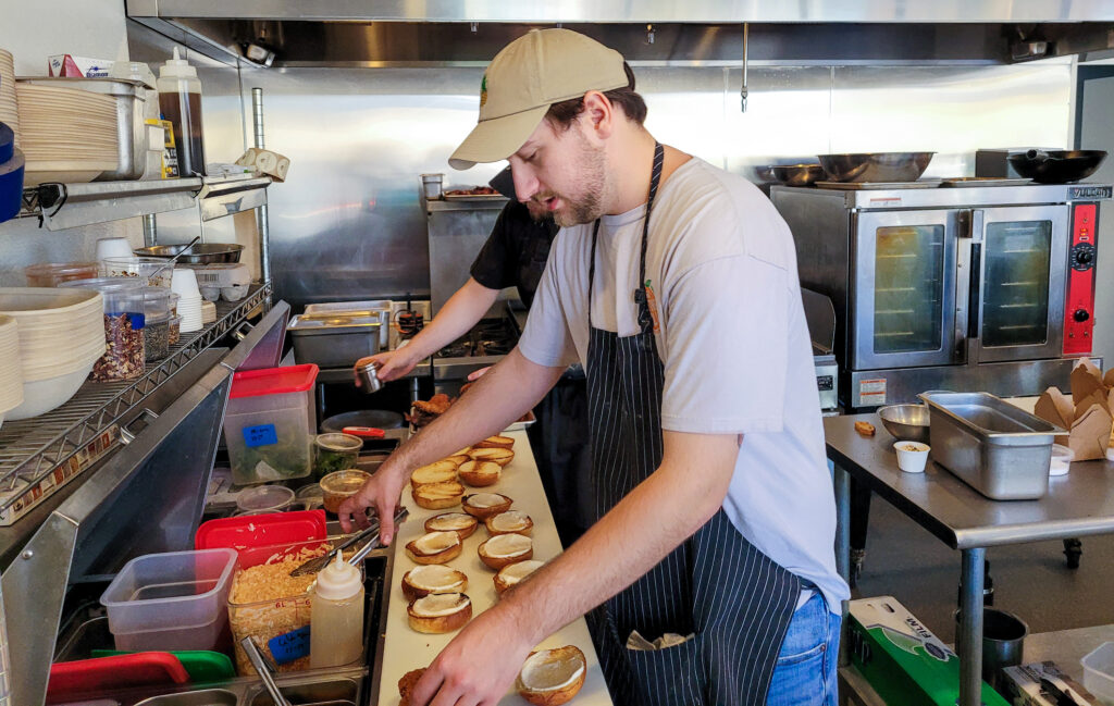 Making fried chicken sandwiches at Belfare Sonoma. (Heather Irwin / The Press Democrat)