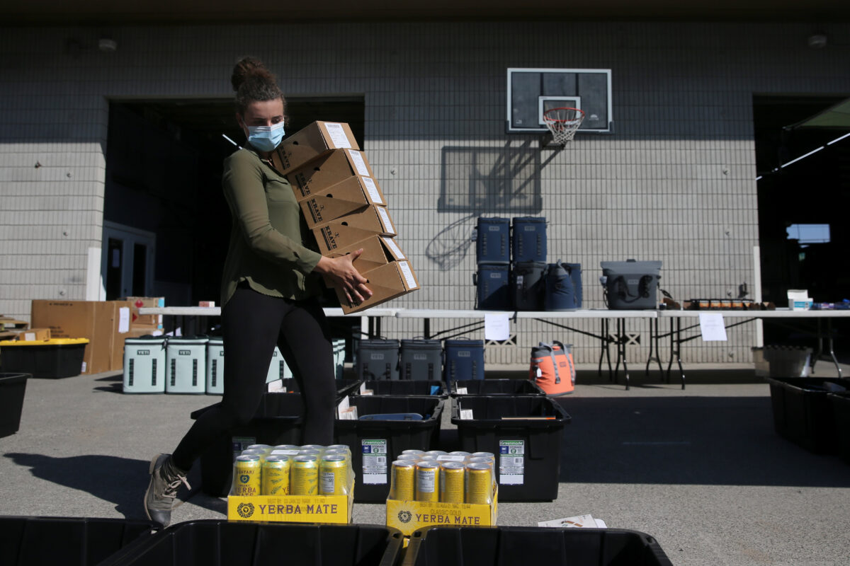 Volunteer Leilani Wirth Martin helps to create boxes for volunteer firefighters as part of a project organized by the Volunteer Fire Foundation at the Gold Ridge Fire Protection District's Hessel station in Sebastopol. (Beth Schlanker/The Press Democrat)