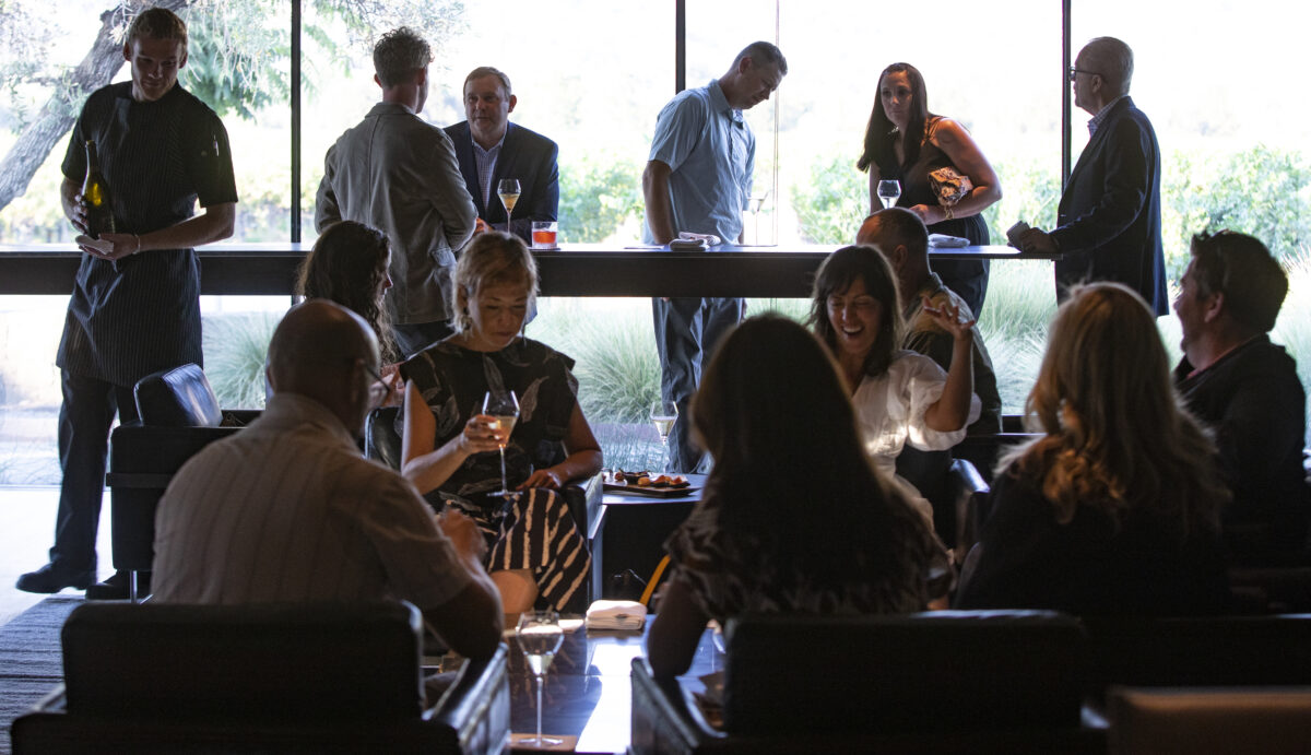 During a family and friends pre-opening night guests enjoy sparkling wine and canapes in the bubble room at Cyrus in Geyserville on Thursday September 8, 2022. (Chad Surmick / Press Democrat)