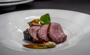 Beef, squash and maitake are plated for service at Cyrus in Geyserville. (Chad Surmick/The Press Democrat)