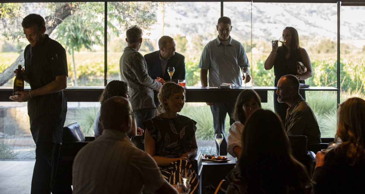 During a family and friends pre-opening night guests enjoy sparkling wine in the bubble room at Cyrus in Geyserville on Thursday September 8, 2022. (Chad Surmick / Press Democrat)