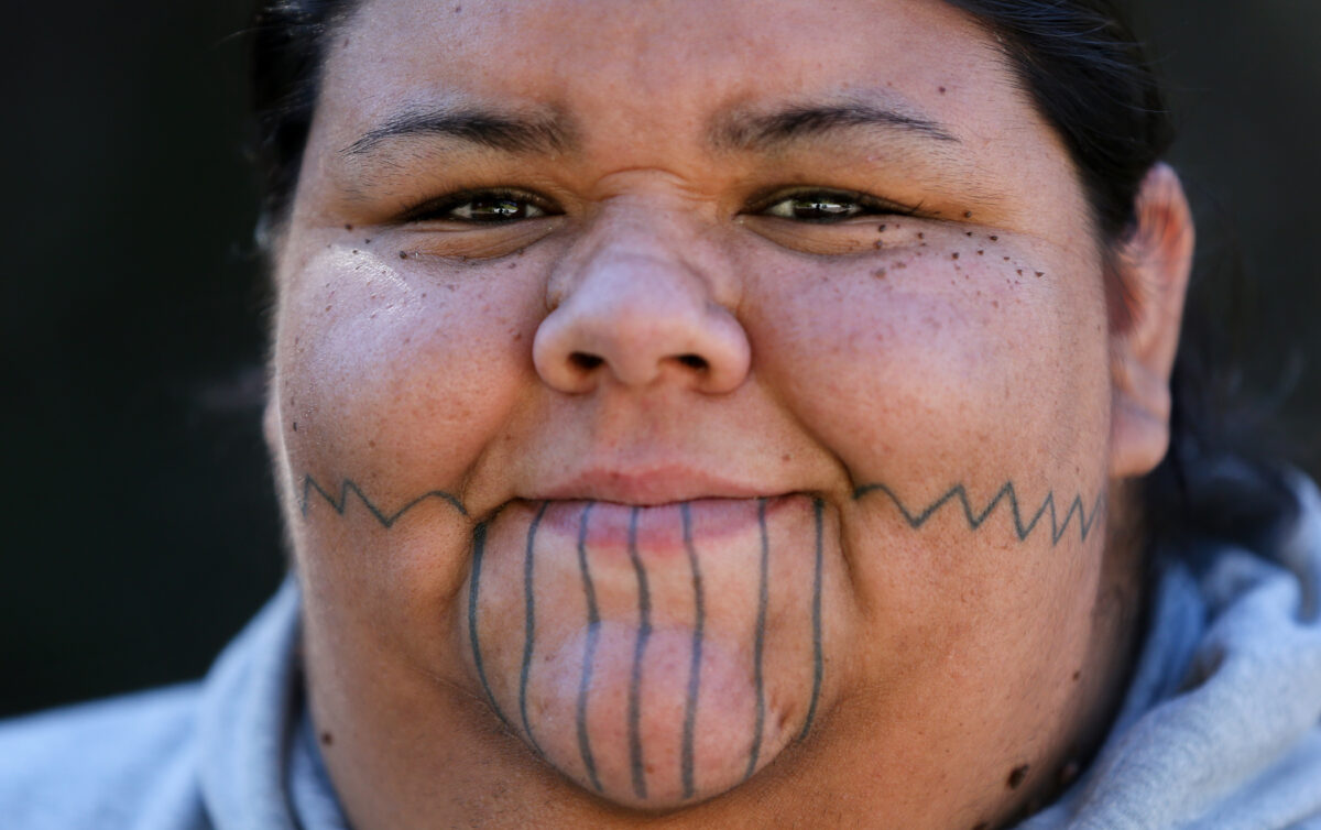 Rose Hammock is the co-leader of The Pomo Project. Hammock also makes herself available to schools and groups as a cultural resource by giving presentations on Native American History. Her facial tattoos represent symbols from her Pomo culture. (Christopher Chung/ The Press Democrat)