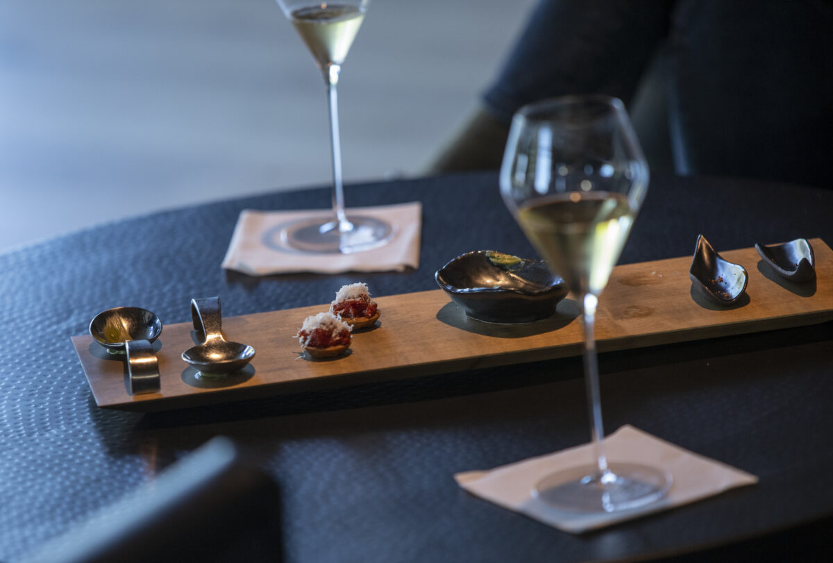 During a family and friends pre-opening night guests enjoy sparkling wine and canapes in the bubble room at Cyrus in Geyserville on Thursday, September 8, 2022. (Chad Surmick / The Press Democrat)