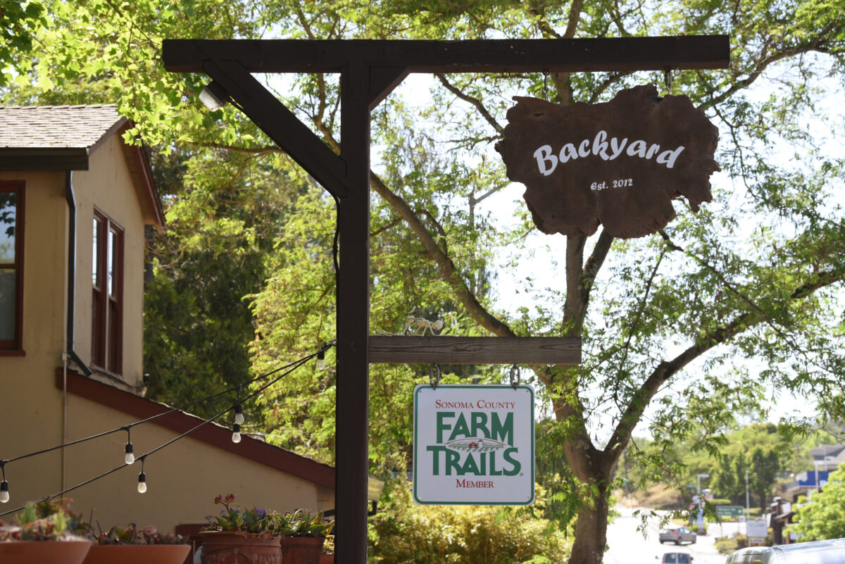 The familiar sign of Daniel Kedan and Marianna Gardenhire?s Backyard restaurant which is permanently closing June 6 after making it through the pandemic in Forestville, Calif. on Tuesday, May 18, 2021. (Photo: Erik Castro/for The Press Democrat)