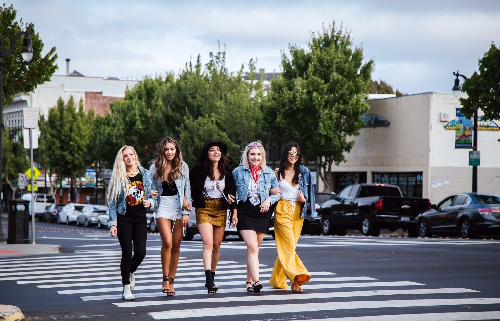 Mercedes Hernandez, center, models Bow & Arrow clothing with her team. (Elise Aileen Photography)
