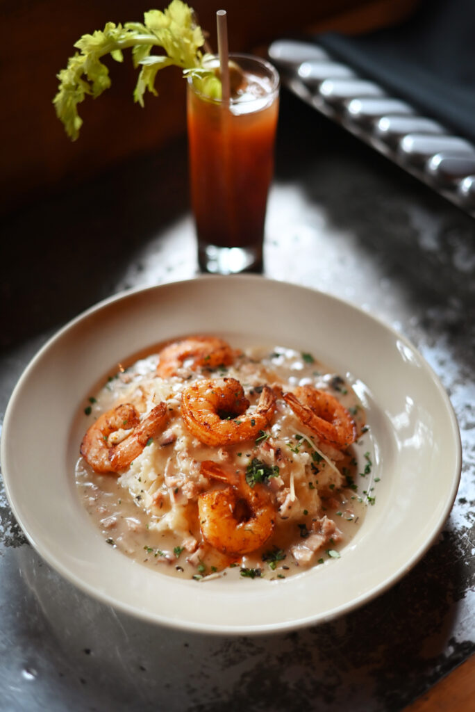 Shrimp and grits with chorizo sausage Creole gravy at Agriculture Public House at Dawn Ranch in Guerneville. (Erik Castro/For The Press Democrat)