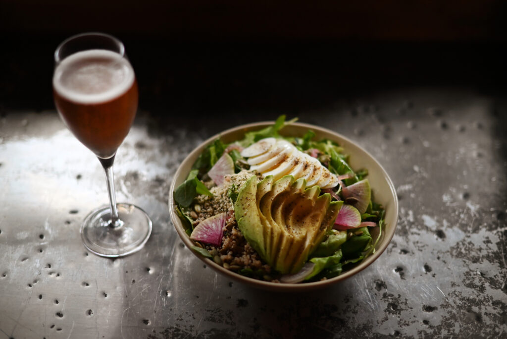 The power bowl, a salad with avocado, hemp seed, quinoa, roasted butternut squash in a fig-apple cider vinaigrette at Agriculture Public House at Dawn Ranch in Guerneville, Calif. on Saturday, Dec. 24, 2022. (Erik Castro / For The Press Democrat)
