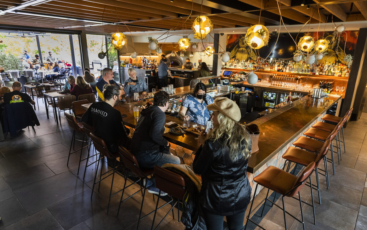 The bar and outdoor patio experience on the third floor Roof 106 at The Matheson in Healdsburg. (John Burgess/The Press Democrat)